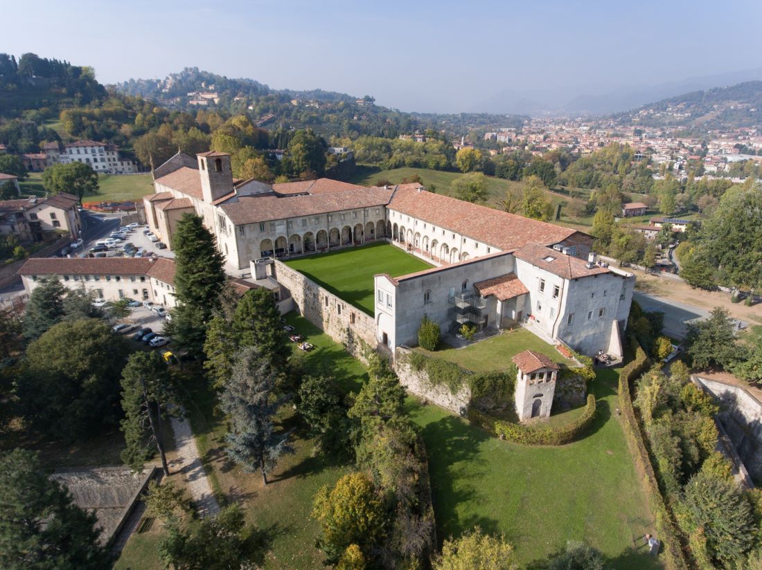 An aerial photograph of the historic seat of Sant'Agostino at the University of Bergamo, in the upper town.The campus of the University of Bergamo is located right in the city and surrounded by a green, mountainous environment