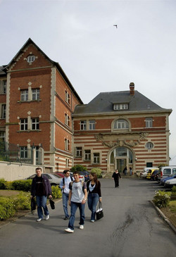 Group of students walking in front of the University Institute of Technology in Aisne, Laon, France.