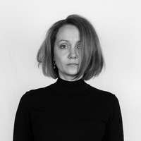 A black and white picture of Julia Albrecht, Artistic Associate at the Professorship Photography at Bauhaus-Universität Weimar