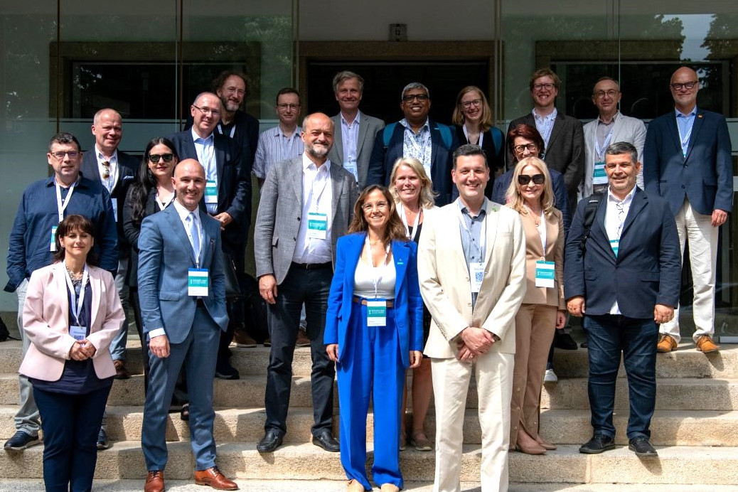 Members of the President's Council are standing on stair steps, posing for a group photo.